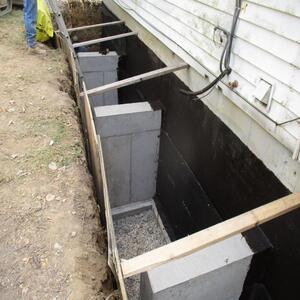 Exterior Waterproofing wrapping the foundation