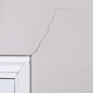 inside wall crack at window casing